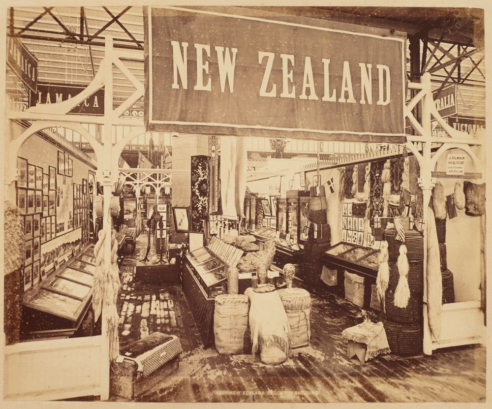 New Zealand exhibition stand displaying specimens, photographs, and ethnographical objects.
