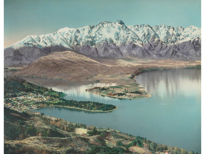 Queenstown. From the album: Hand coloured views of New Zealand; 1940 s; Whites Aviation, 1945-1960, Queenstown, by Whites Aviation. Purchased 1999 with New Zealand Lottery Grants Board funds. Te Papa (O.033079)