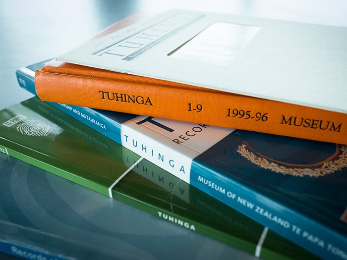A pile of Tuhinga issues on a table