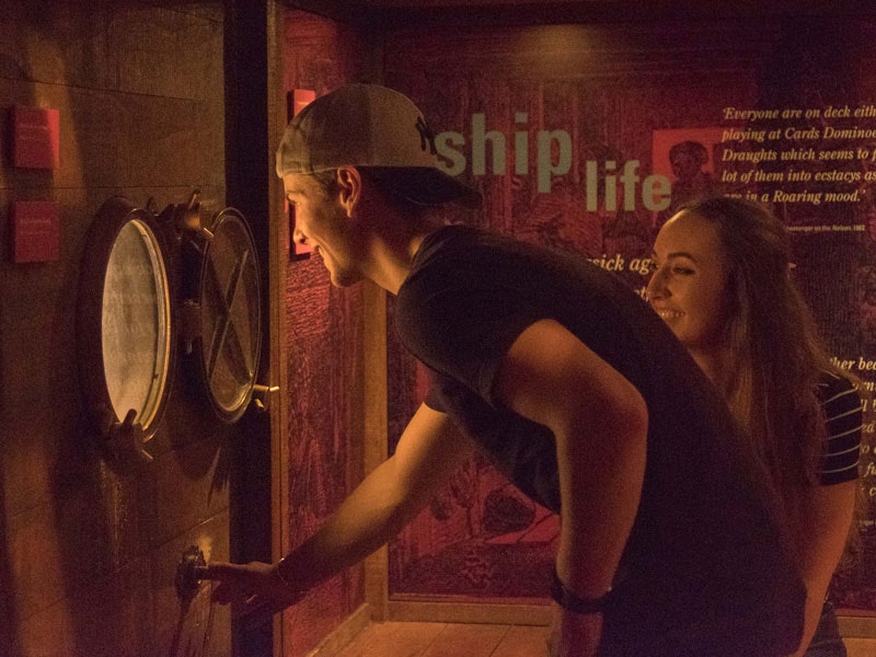 Visitors explore the Passports exhibition