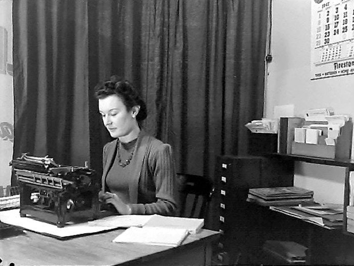 Woman at Desk, 1947, by Gordon Burt, Gordon H. Burt Ltd. Te Papa (B.026730)
