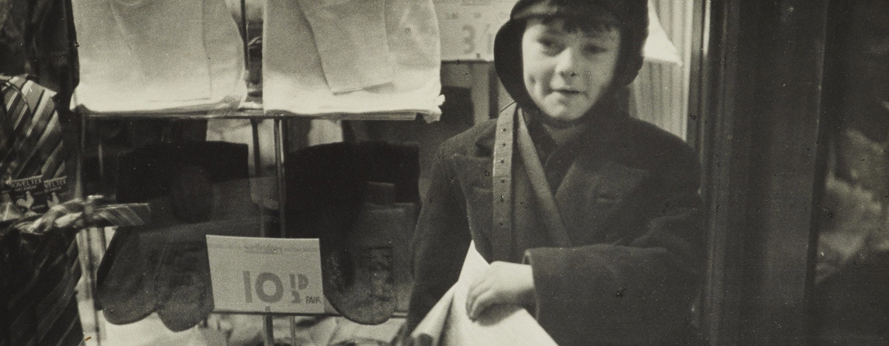 Wellington’s smallest newsboy, Cuba St, 1938, Wellington, by Eric Lee-Johnson. Purchased 1997 with New Zealand Lottery Grants Board funds. Te Papa (O.006586)