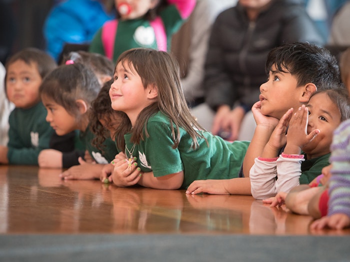 Child listening to a story on the marae during Matariki, 2016. Photograph by Kate Whitley. Te Papa Child listening to a story on the marae during Matariki