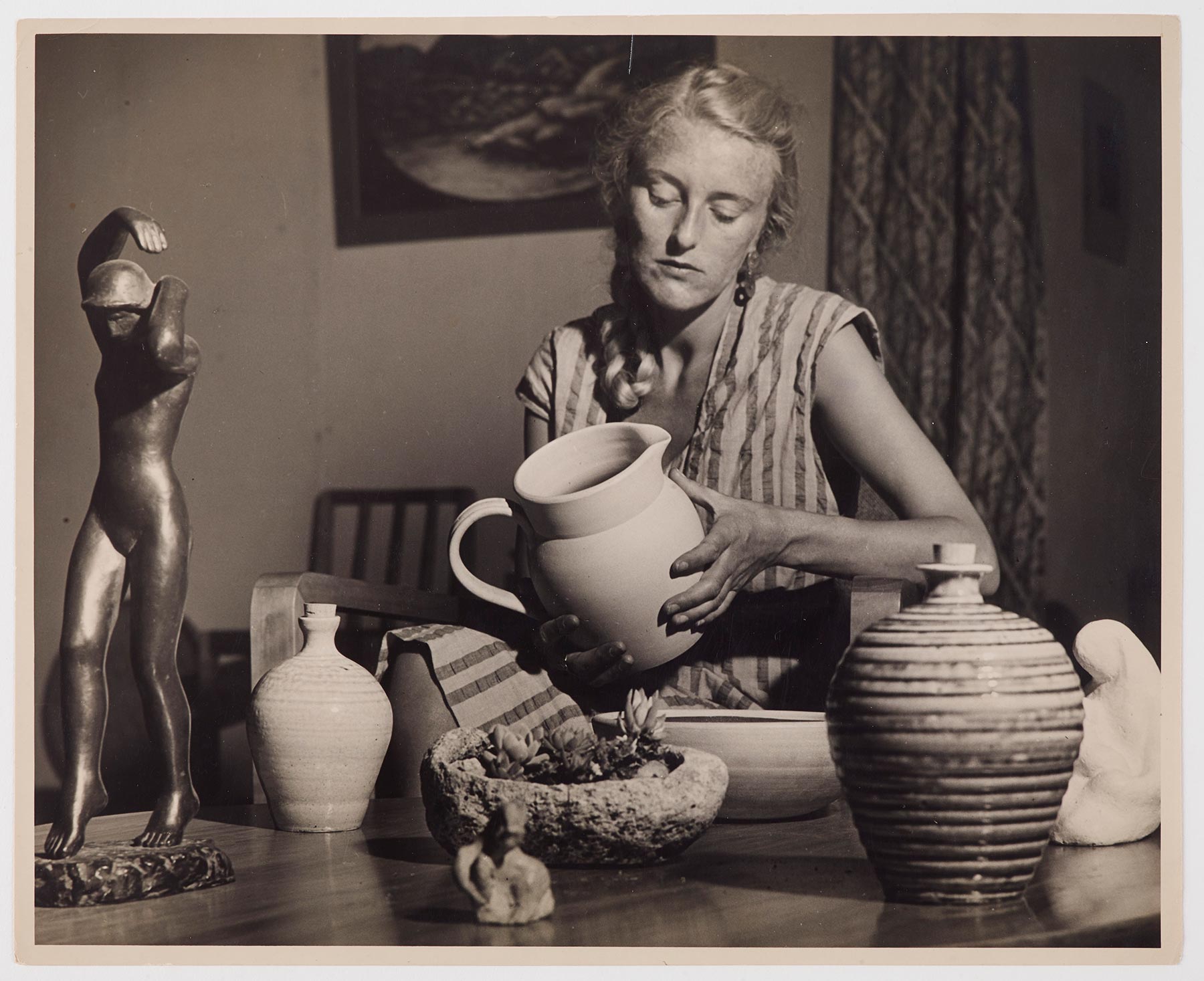 Helen Hitchings examining pottery