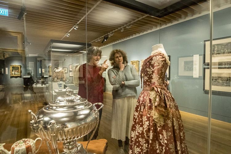 Visitors looking at gowns