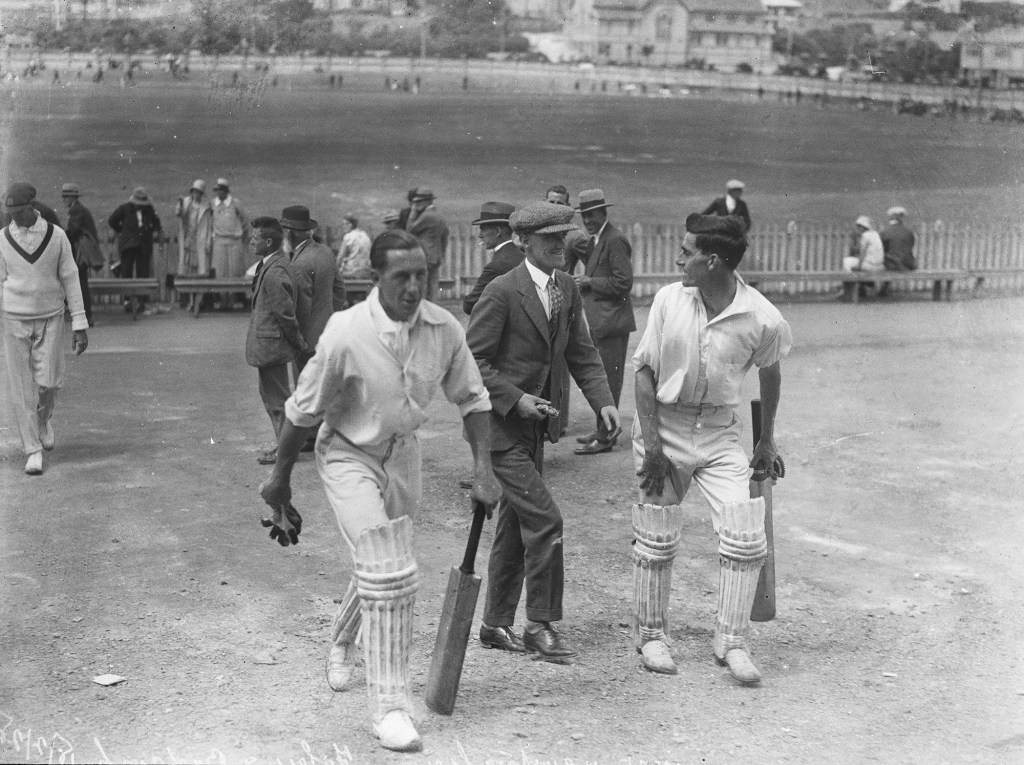 Cricketers exiting the pitch