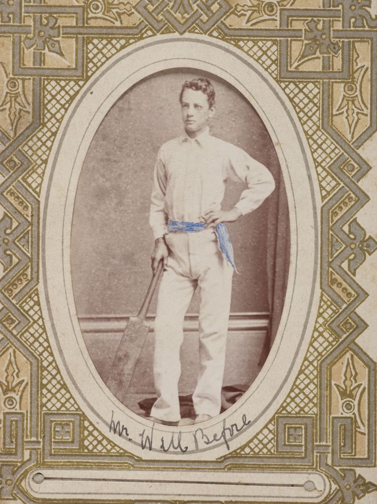 Ornately framed image of man with cricket bat