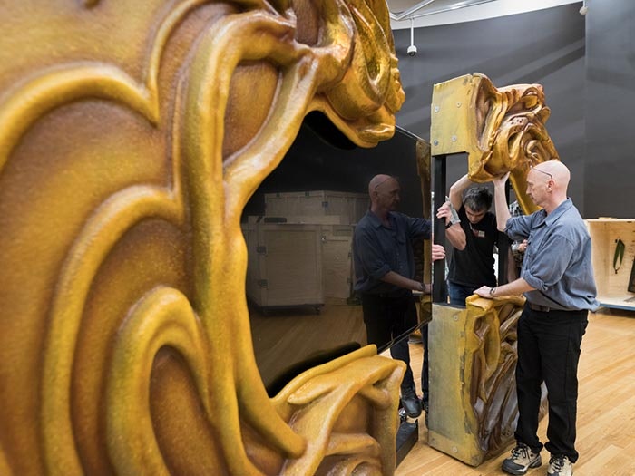 Samsung screen installation in Bug Lab. Photographer Kate Whitley © Te Papa Installation of screen with yellow textured art nouveau border