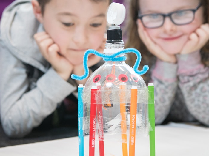 Bugbots, 2016. Photograph by Kate Whitley Children look at the Bug Bot they've made