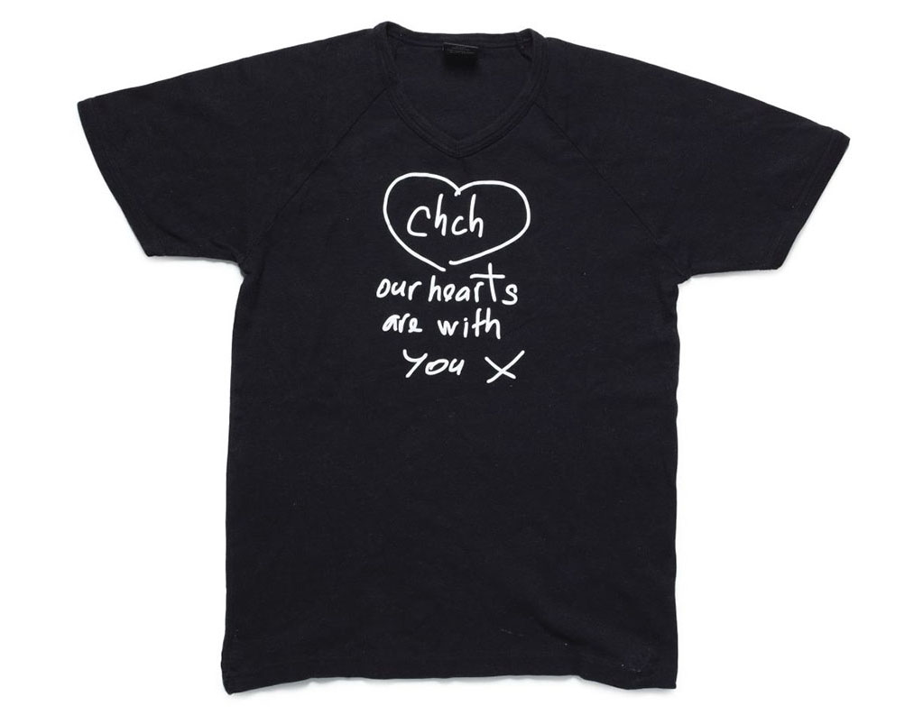 T-shirt featuring a design saying Christchurch our hearts are with you