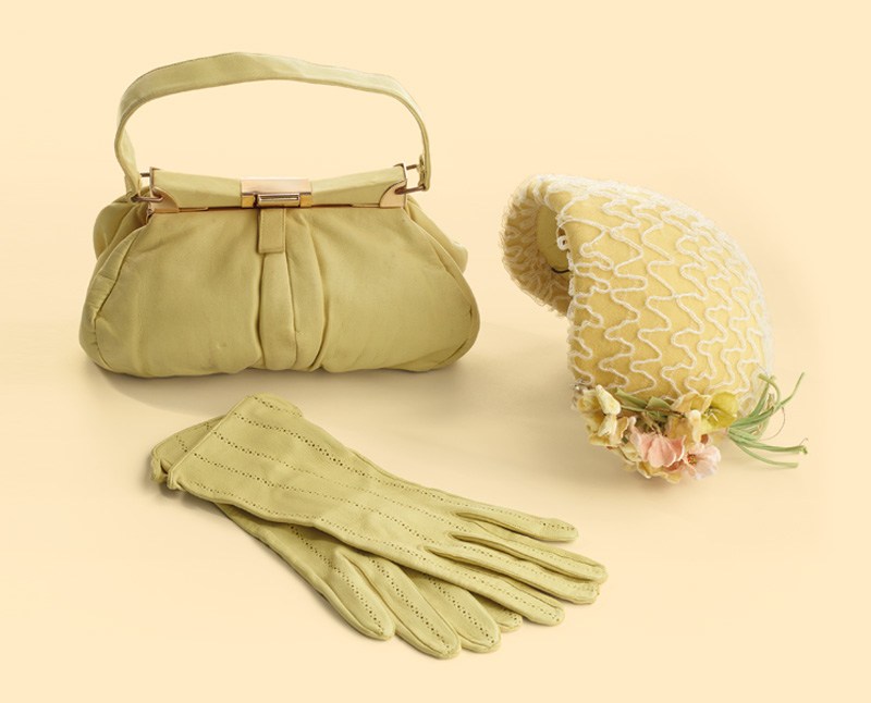 A summer hat, gloves, and handbag