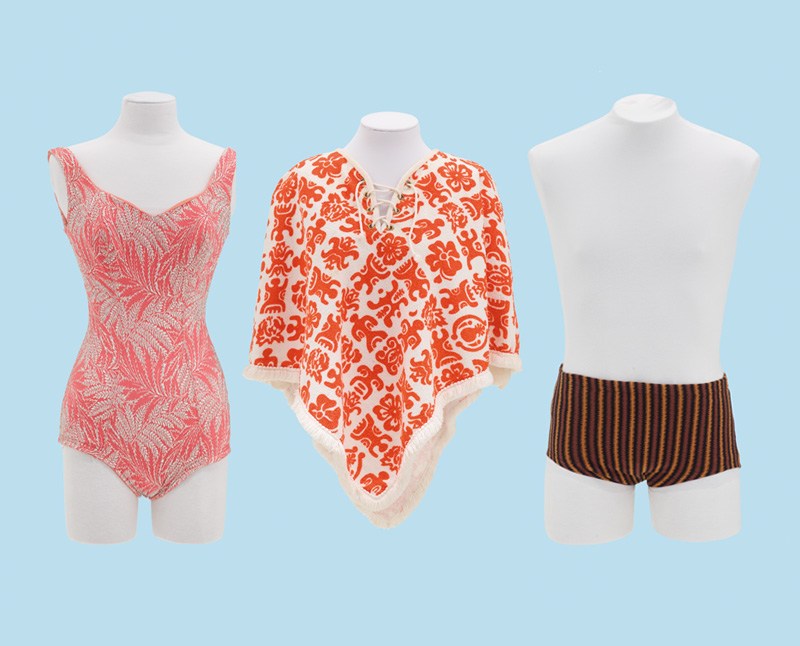 Three varieties of swimwear, including a man's and a woman's bathing costume and a poncho