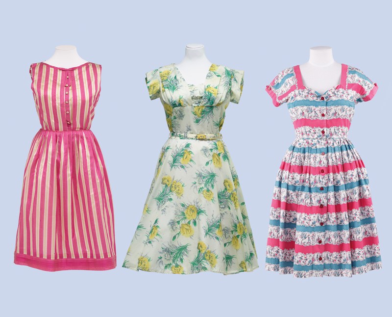 Three vibrant women's dresses