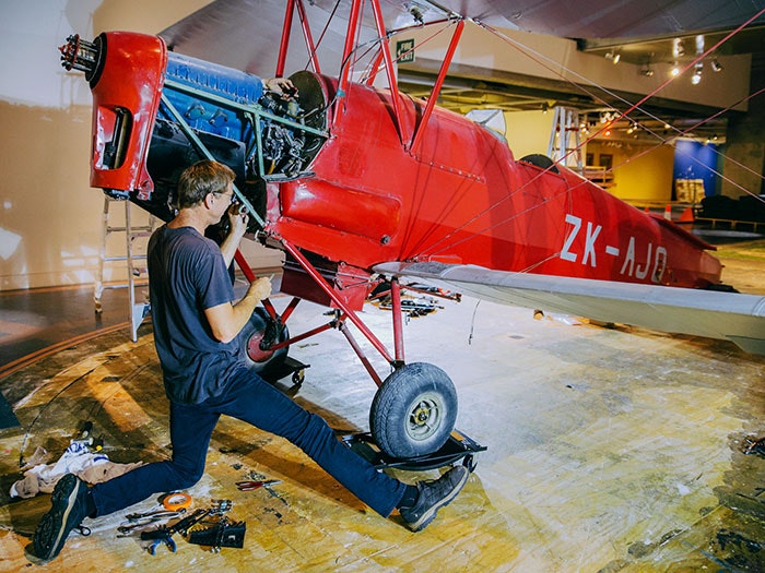 Tiger Moth plane is dismantled on the museum floor