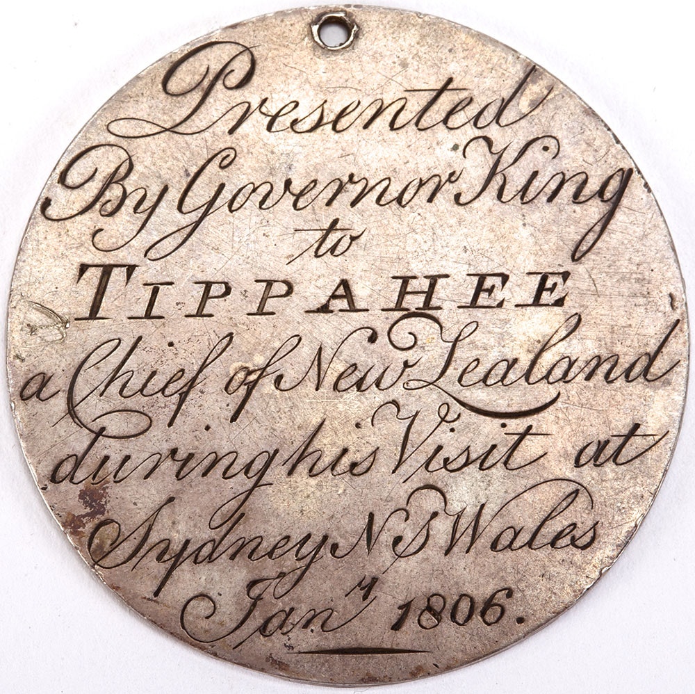 Medal with text engraved that reads Presented by Governor King to Tippahee a Chief of New Zealand during his visit at Sydney NS Wales January 1806