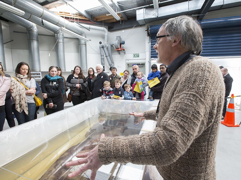 Visitors look at the colossal squid in Te Papa’s fish research facility