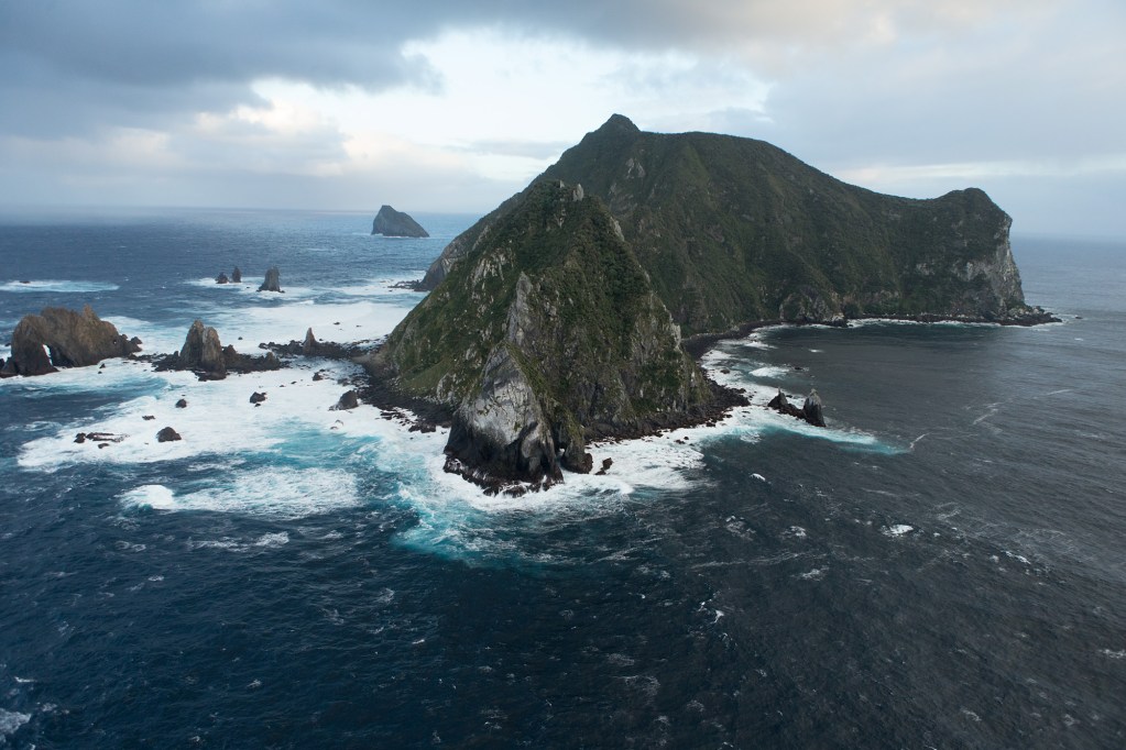Cliffs and rough sea of Solander Island