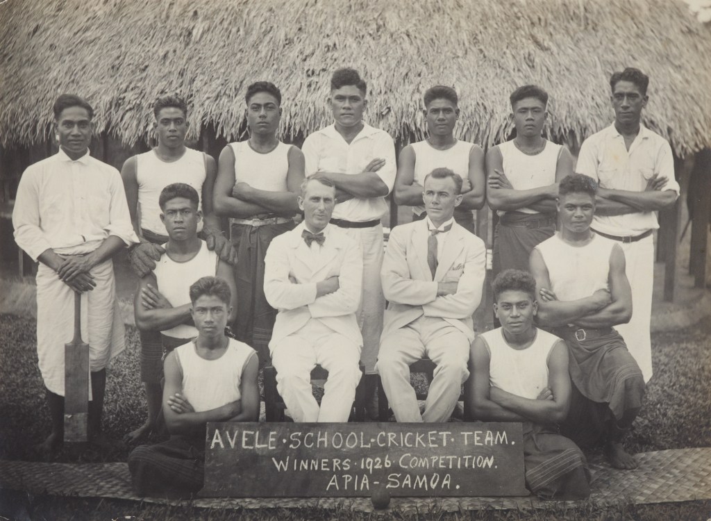 A Samoan cricket team pose with their arms crossed