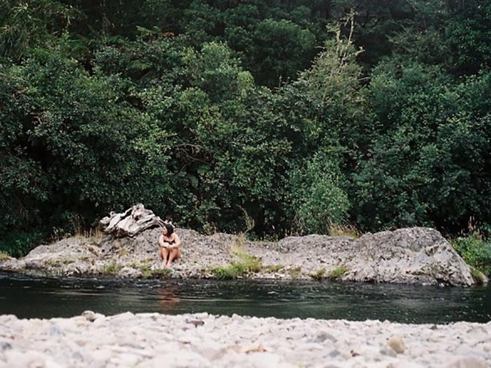 Photograph by Kahu Kutia, courtesy of The Wireless Woman sits on a riverbed