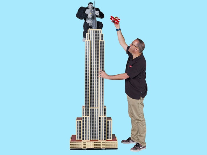Man with giant LEGO model of the Empire State Building
