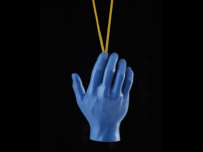Blue hand hanging from a yellow necklace
