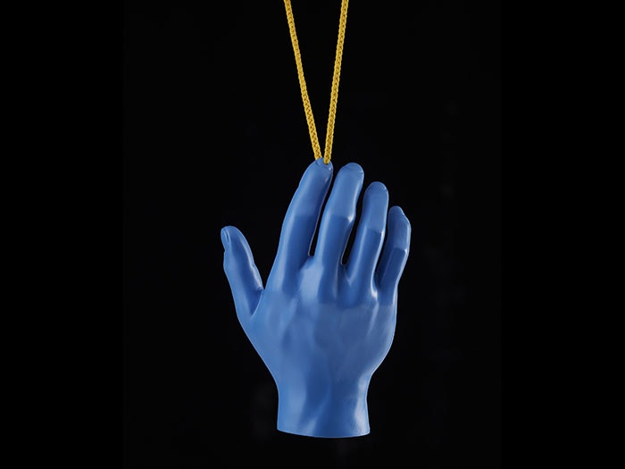 Blue hand hanging from a yellow necklace
