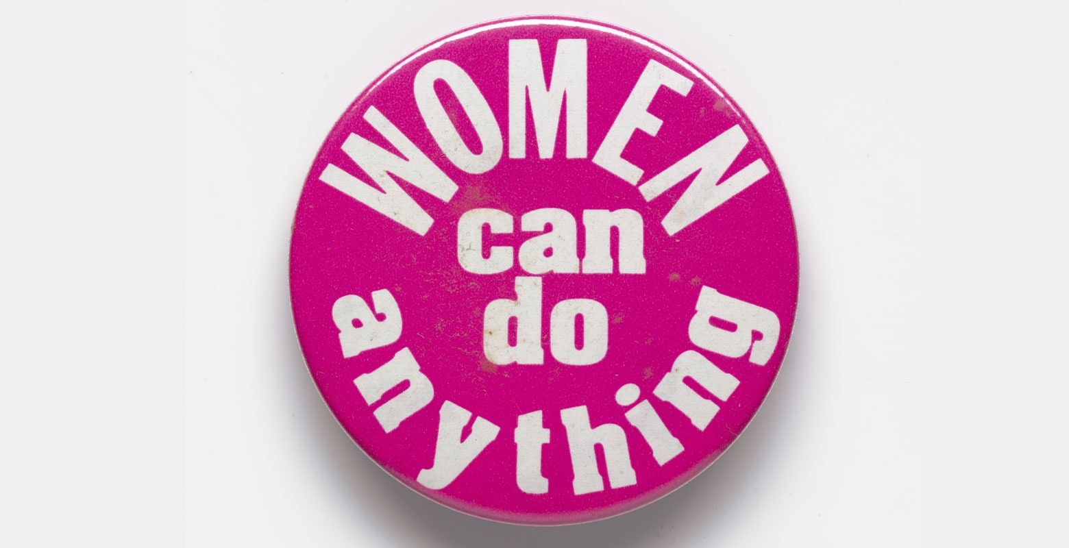 Pink badge with the words 'Women can do anything'