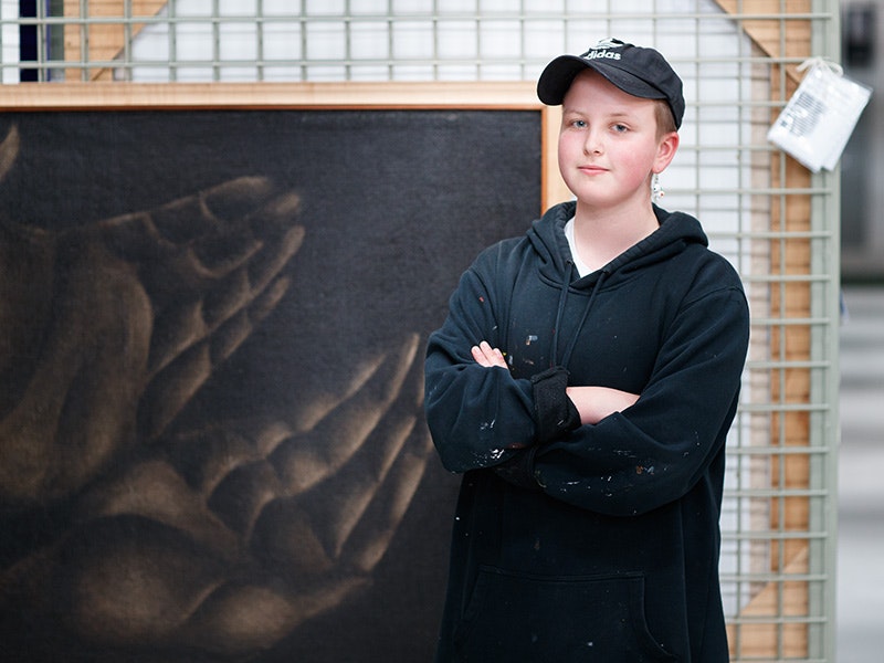 Elijah Neilson in front of Tony Fomison, Study of hands on page 235 of “Roxburgh’s Common Skin Diseases” 12th edition 1961, 1971, oil on hessian. Te Papa (1997-0007-1) =""