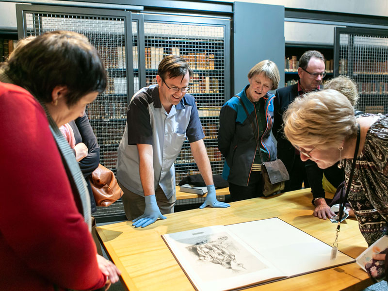 People looking at rare books