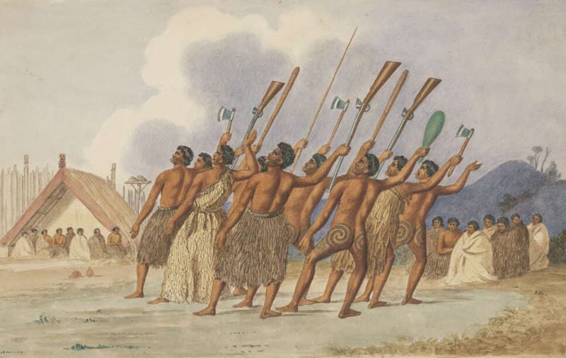 A group of Māori perform a haka with various weapons, including guns, raised in the air
