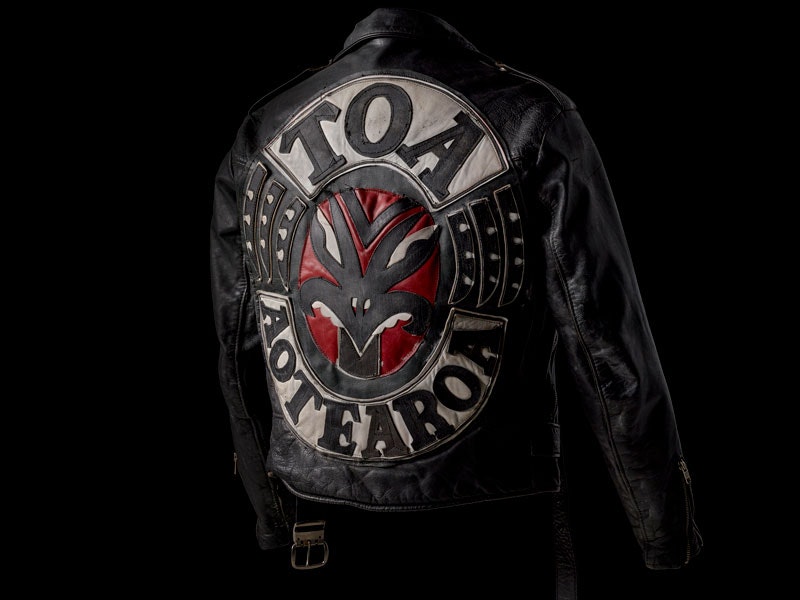 A black leather gang jacket with the word 'Toa Aotearoa' on it