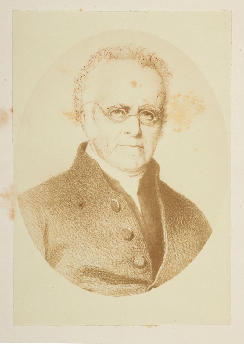 Sepia portrait of a man, he wears glasses