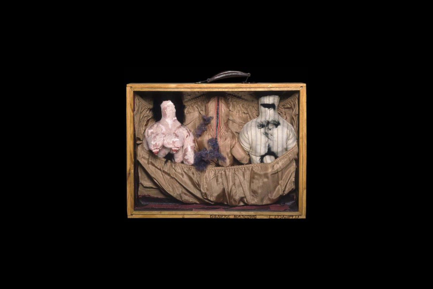 Wooden suitcase frame contains sewn naked male and female dolls