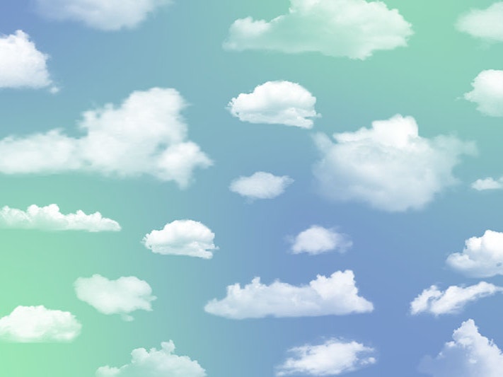 White clouds on a bluey-green sky