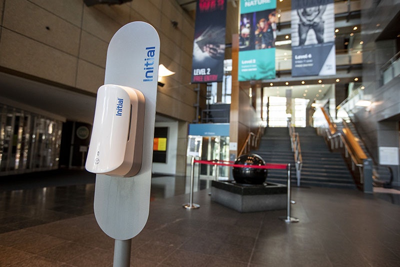 A dispenser for hand sanitiser stands in the entrance foyer of Te Papa