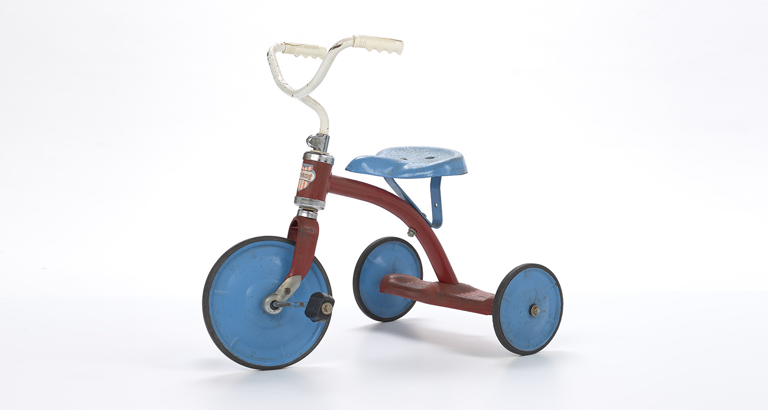 A blue, red and white tricycle