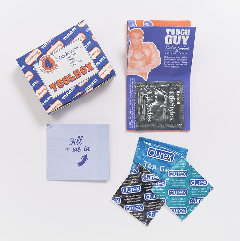 Box of condoms, with its contents, condoms and instructions, beside it