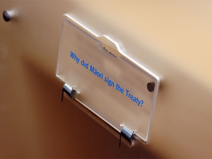 Treaty 2U exhibition, 2006. Photo by Jo Moore. Te Papa (83258) A plastic label on a wall with the text "Why did Māori sign the treaty?" written on it