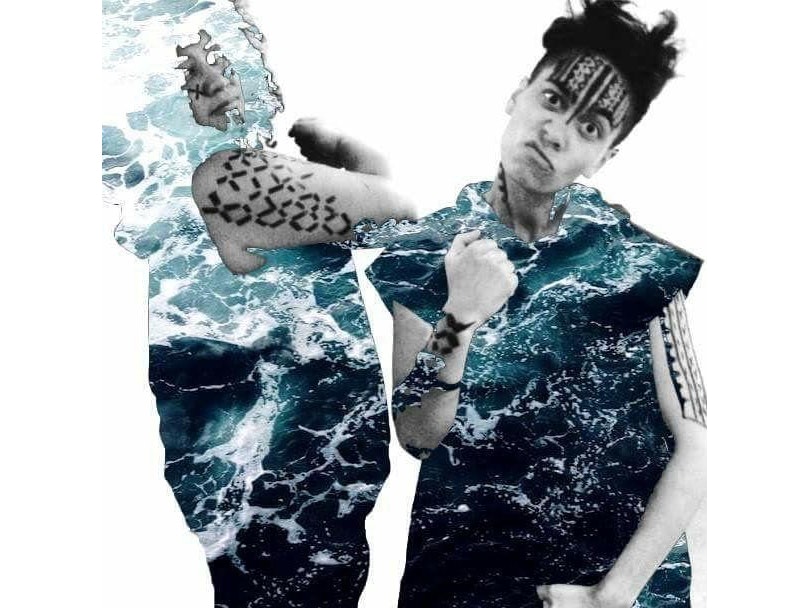 Art photo of two people with hooded tops on that look have waves of the ocean photoshopped onto them