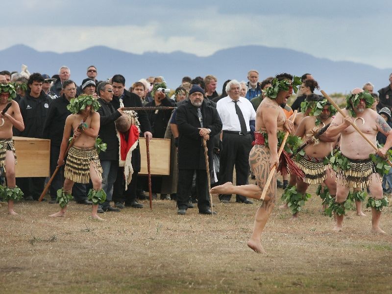 Picture of a repatriation at Wairau bar showing iwi holding caskets