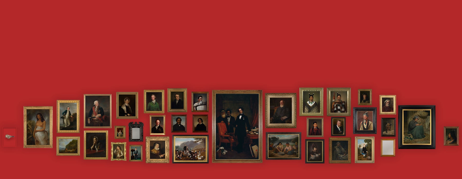 A selection of portraits lined up on a red wall