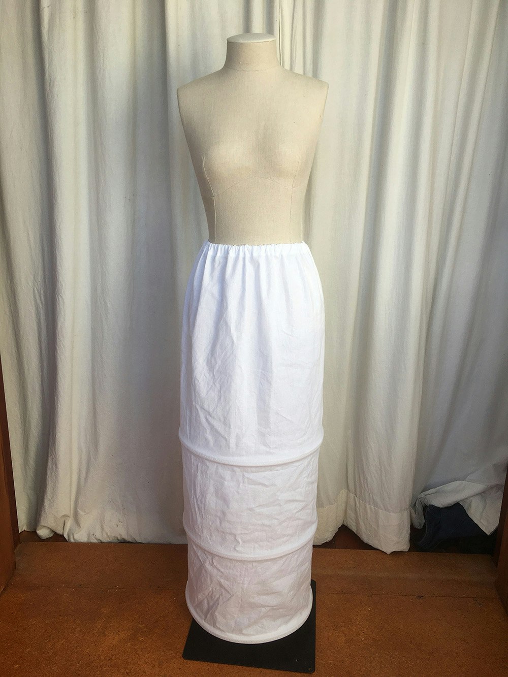 A white skirt on a dressmakers dummy