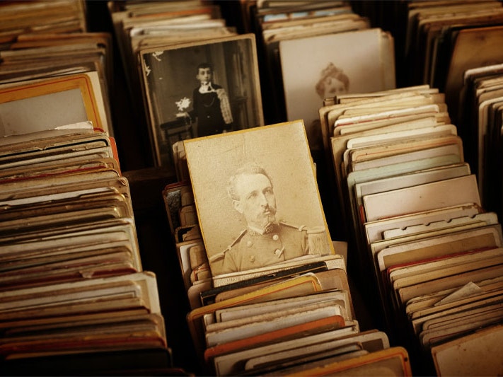 A stack of old photos. Photo by Fabien Barral via Unsplash A stack of old photos