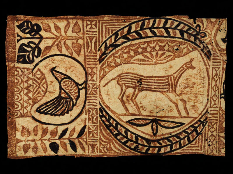 Material made from bark with animals designs painting on it in brown natural colours