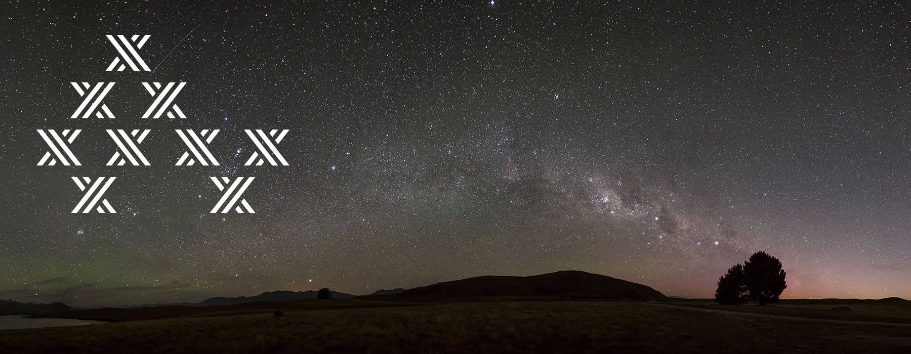 A panoramic view of the early morning sky showing many, many stars in the sky