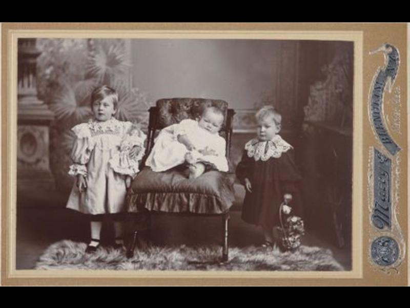 An old photo of a family portrait in a studio