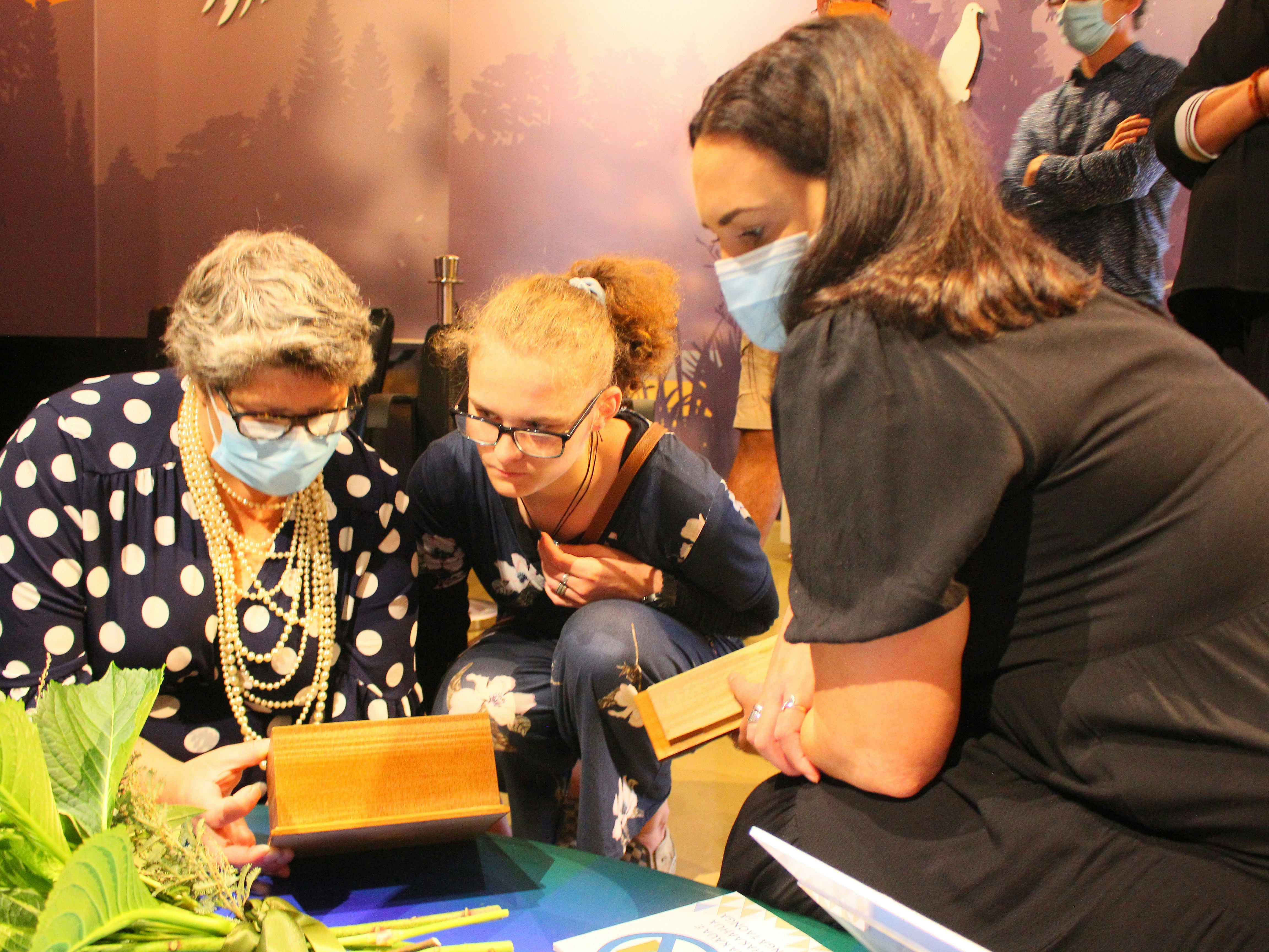 Photos of staff at Te Awamutu Museum looking at the remains of Walter Herford
