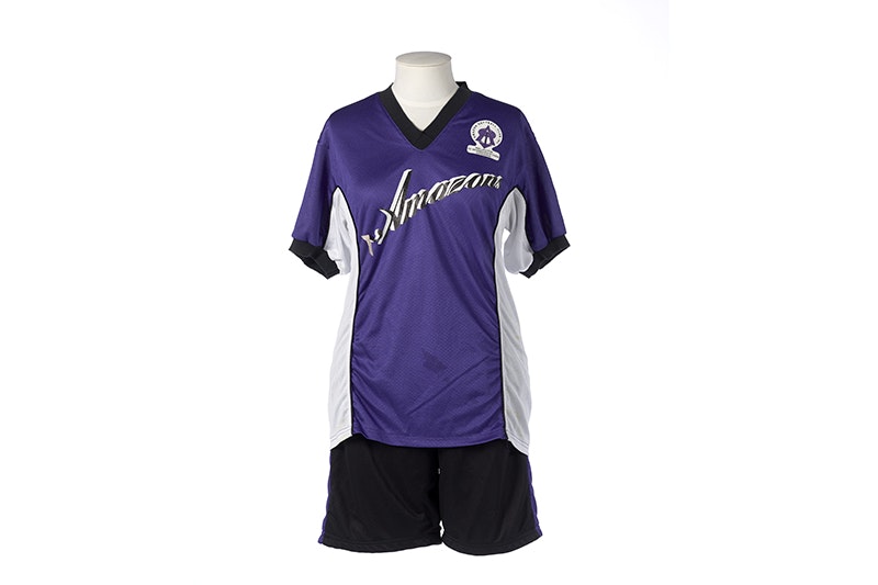 A purple, black and white sports outfit on a mannequin