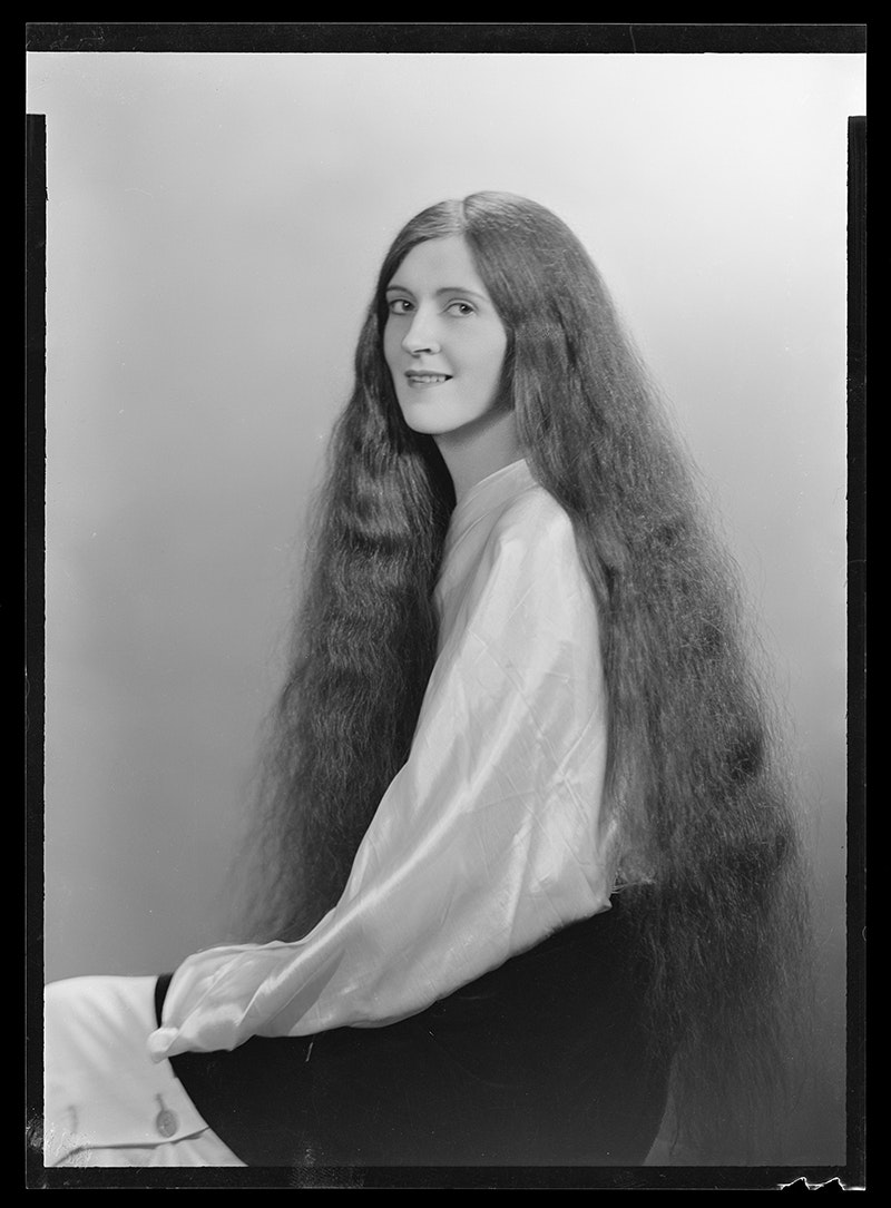 A black and white photo with very long hair