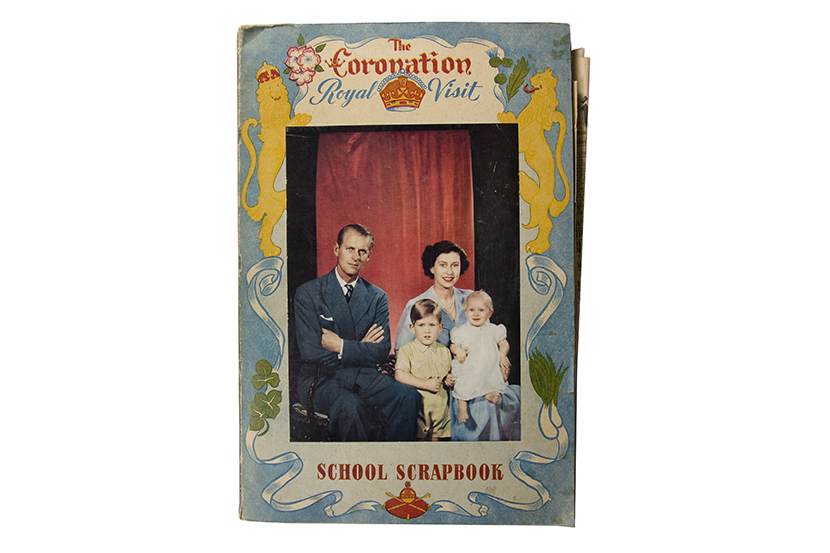 A softcovered book with a picture of a couple with two children